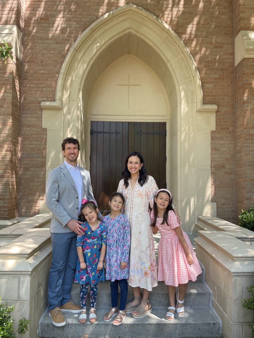 Timothy Van Heest with his wife and three daughters outside their church
